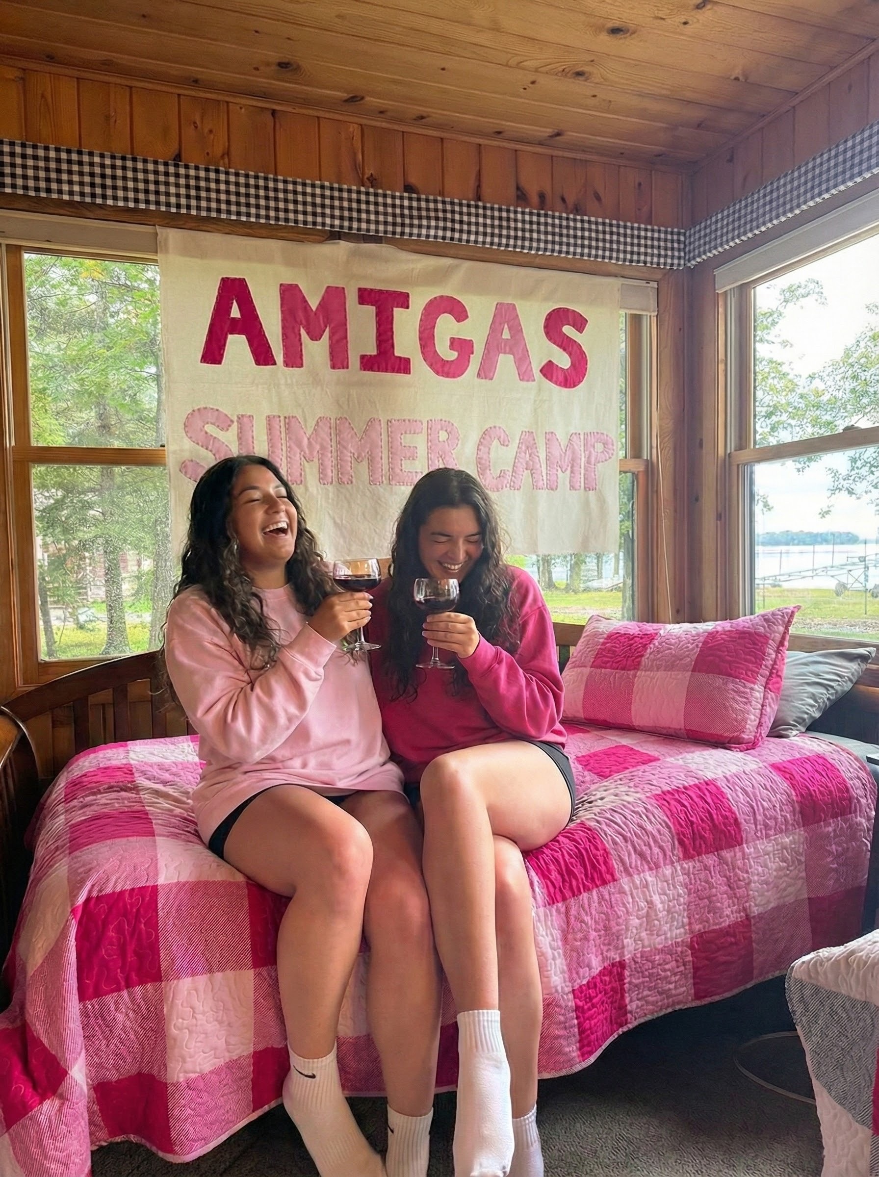 Amigas laughing together at Summer Camp